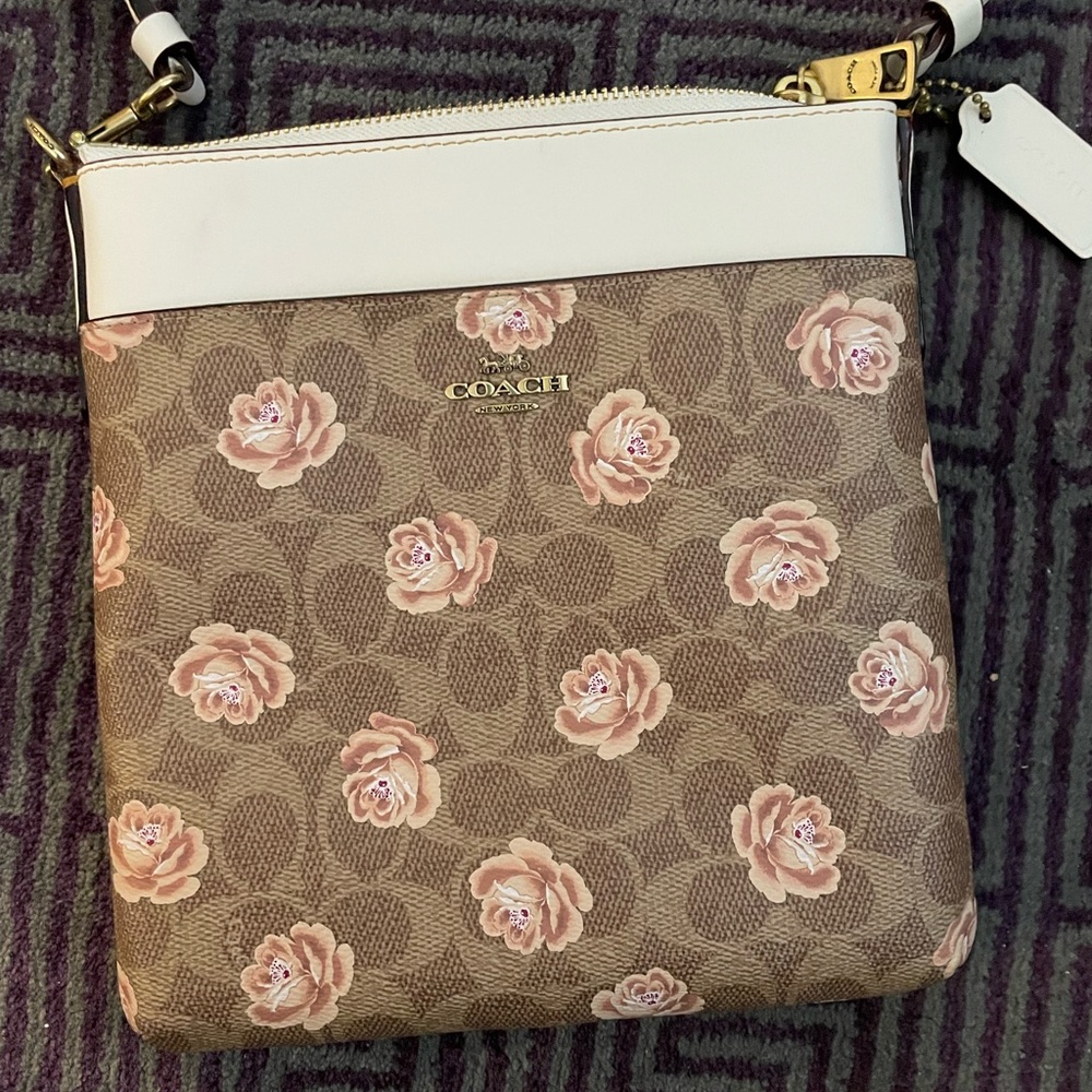 Coach Signature Roses cross-body bag.
